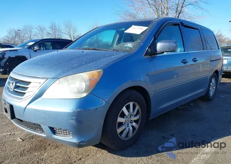 2010 Honda Odyssey Ex-L z USA, uszkodzony, nr VIN 5FNRL3H75AB050333